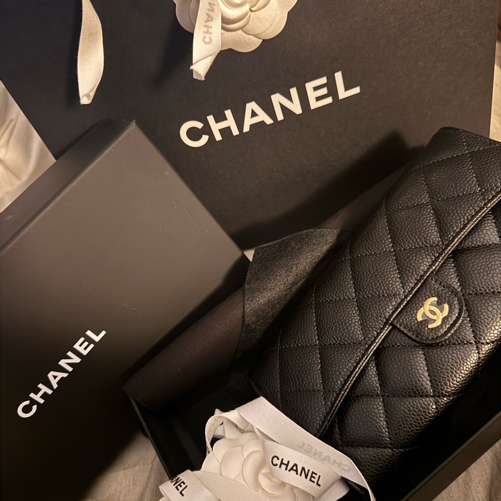 CHANEL Black Clutch with Quilted Leather and Gold Hardware